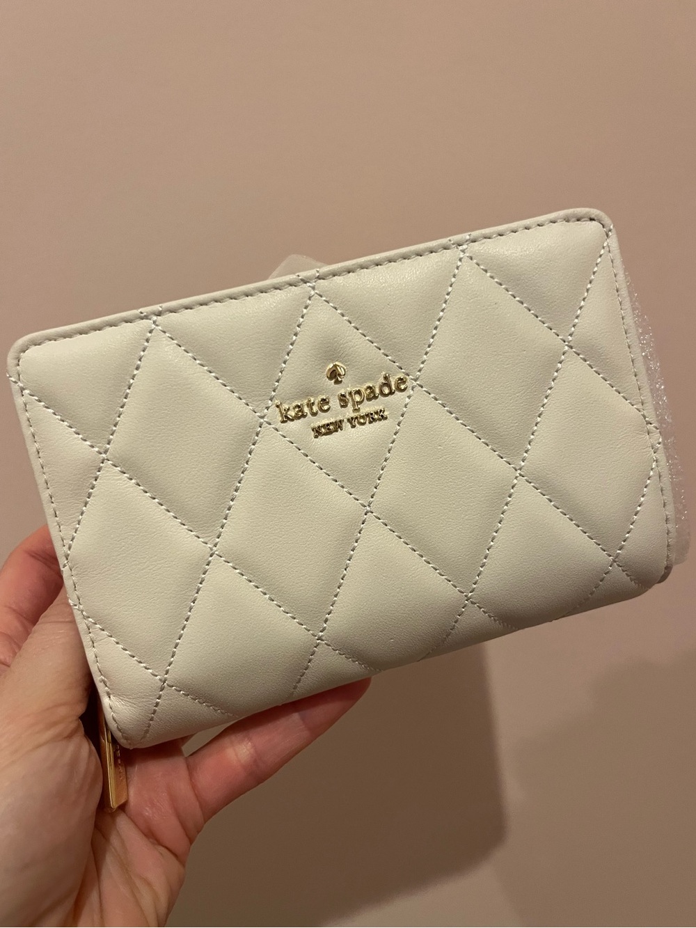 kate spade Carey Madison cream small bifold wallet